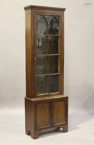 A 19th century mahogany narrow bookcase cabinet with lancet arch glazing, height 218cm, width