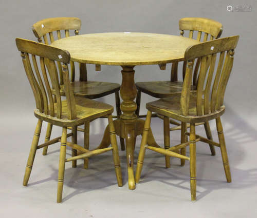 A 20th century Victorian style pine tip-top supper table, height 77cm, diameter 93cm, together