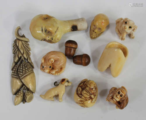 A small group of ivory and bone items, including a Japanese ojime, carved in the form of Daruma in