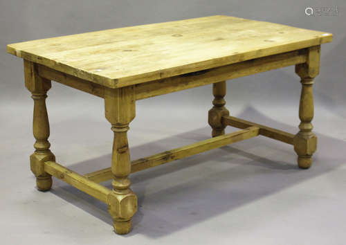 A 20th century Victorian style pine kitchen table, on turned and block legs, height 77.5cm, length