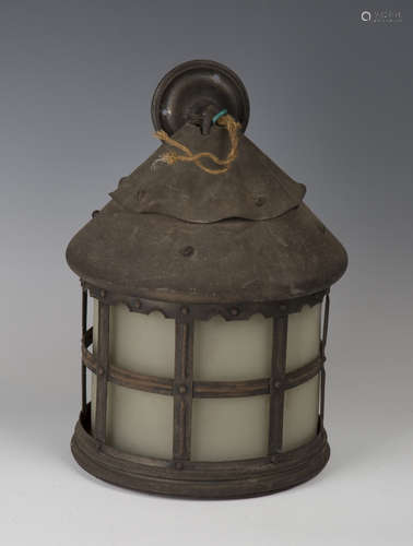 An early 20th century Arts and Crafts patinated tin cylindrical hall lantern, in the manner of