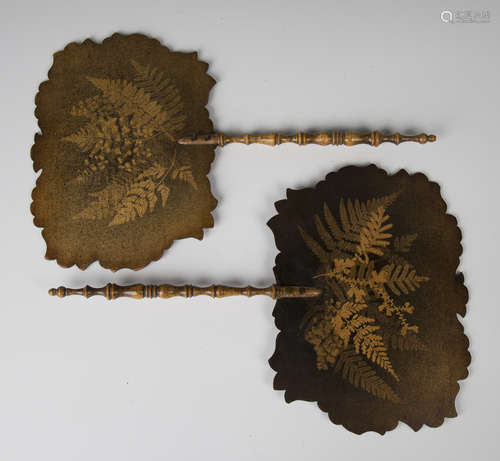 A pair of Victorian fernware face screens, each fitted with a turned handle, length 38cm, width