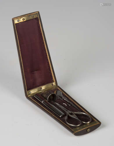 A 19th century French walnut and boxwood inlaid étui, the hinged lid enclosing a fitted interior