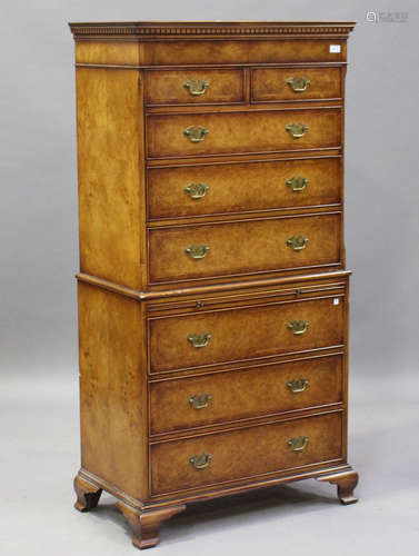 A late 20th century reproduction walnut tallboy by Brights of Nettlebed, fitted with eight drawers