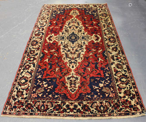 A Bakhtiari carpet, North-west Persia, early/mid-20th century, the red field with a shaped ivory