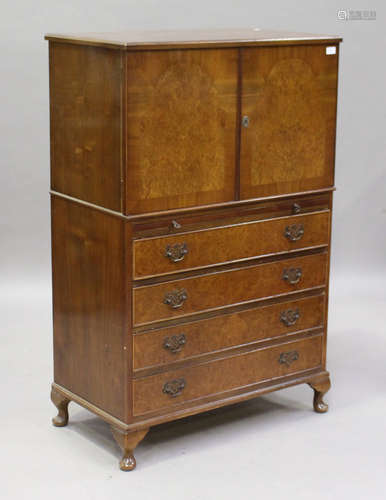 An early/mid-20th century burr walnut tallboy, fitted with a cupboard above a slide and four