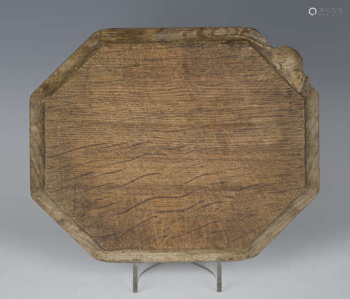 A Robert 'Mouseman' Thompson oak cheese board of canted rectangular form, one corner with typical