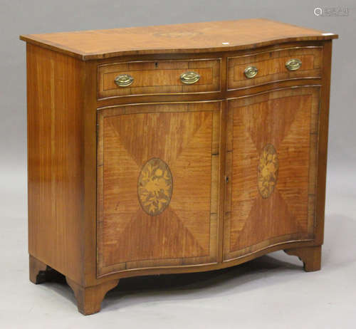 A 20th century George III style satinwood serpentine-fronted side cabinet with crossbanded and