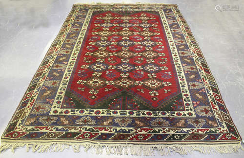 A Shiraz carpet, South-west Persia, mid/late 20th century, the claret field with overall rows of