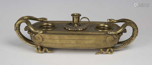 A mid-19th century gilt bronze inkstand, finely cast in the form of a boat with serpent handles, the