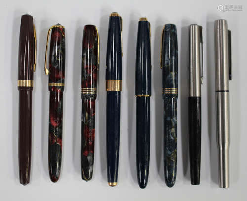 A quantity of fountain and roller ball pens, including four Burnham fountain pens and various Parker