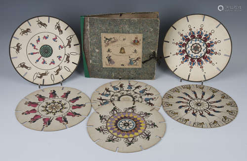 A group of 19th century Fantascope discs, comprising a set of six hand-coloured discs and their