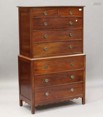 A George V mahogany chest-on-chest, fitted with two short and six long drawers, on block legs,