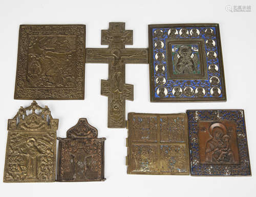 A group of mainly 19th century Russian cast brass icons, including a rectangular enamelled