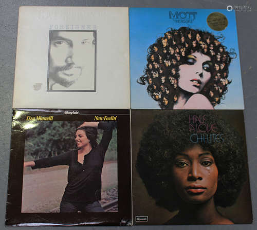 A small collection of LP records, including albums by Mott the Hoople, Ella Fitzgerald and Abba.