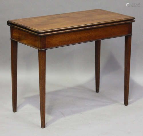 A George III mahogany fold-over card table, the top with chequer stringing, height 74cm, width 90cm,