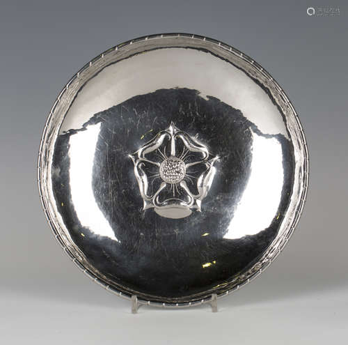 A Keswick School of Industrial Arts 'Firth Staybrite' circular dish worked with Tudor rose to