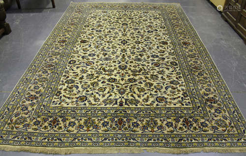 A Kashan carpet, Central Persia, mid/late 20th century, the ivory field with overall scrolling