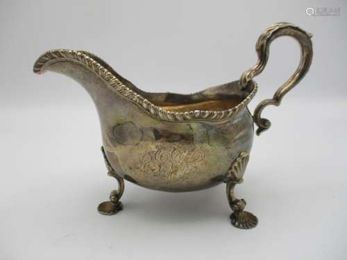 A George II silver sauce boat by Daniel Smith & Robert Sharp, London 1759, modelled with a gadrooned