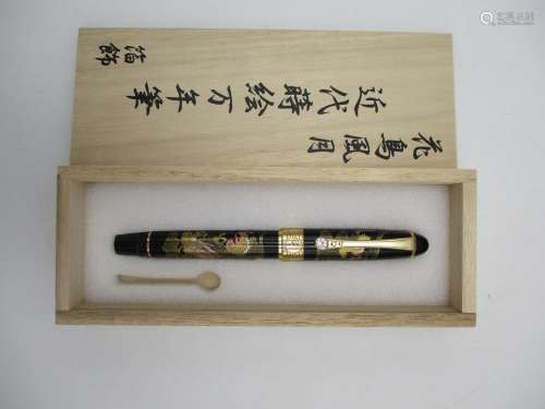 A Japanese Maki-e fountain pen, decorated with a lacquered design of an Imperial dragon, with