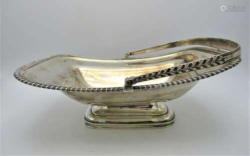 A large George IV silver swivel handle basket by William Eaton, London 1821, of rectangular form