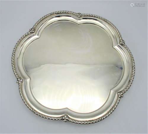 A George V silver salver by Levesley Brothers, Sheffield 1910, with lobed rim with flower detail