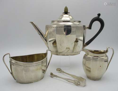 A George V silver three piece tea set by Alexander Clark & Co Ltd, Sheffield 1923, comprising a