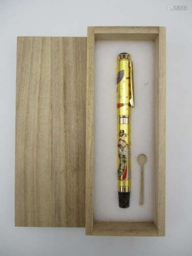 A Japanese Maki-e style fountain pen, the lacquer design depicting a geisha with fans and cherry