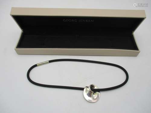 A Georg Jensen silver Mobius No 374 pendant on a later necklace, boxed