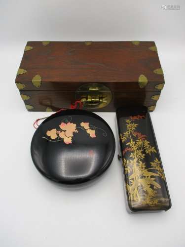 A Japanese wooden zenibako box with brass mounts, with frontal lock mechanism in the form of a fish,