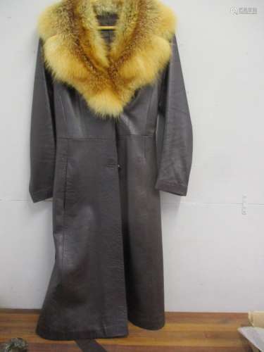 A retro ladies dark brown leather coat with red fox fur collar, together with a full length mid