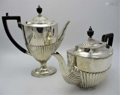 A Victorian silver tea pot by Mappin & Webb, Sheffield 1893, of oval form with part fluted body