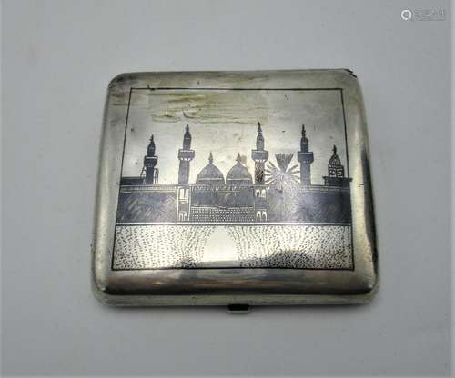 An early 20th century Egyptian silver Niello card case of curved, cushion form decorated with the