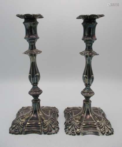 A pair of Victorian silver candlesticks by Henry Wilkinson, Sheffield 1894, designed with knapped