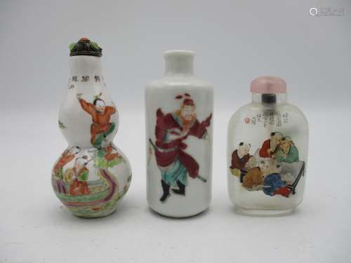A small collection of three Chinese scent bottles, to include a rouleau model with applied enamels