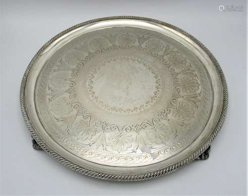 A Victorian silver circular salver by Walter and John Barnard, London 1878, designed with etched