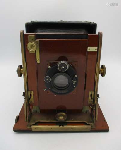 A Compur Tropical cased folding camera by Houghtons Ltd, London, in teak wood with brass fittings,
