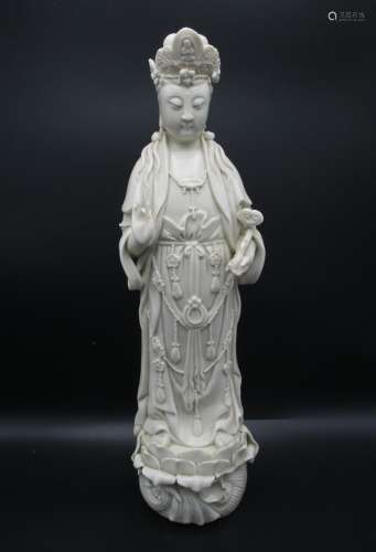 A Chinese Qing dynasty Dehua model of Guanyin, the deity dressed in jewelled draped clothing,