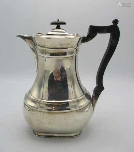A George V silver coffee pot by William Hutton & Sons, Sheffield 1911, with ebonised handle and