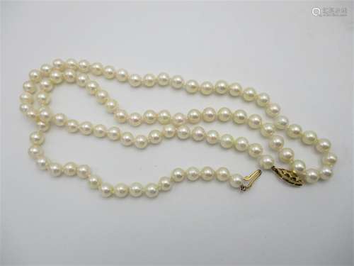 A single row cultured pearl necklace, 88 uniformed pearls hanging on a 9ct gold clasp