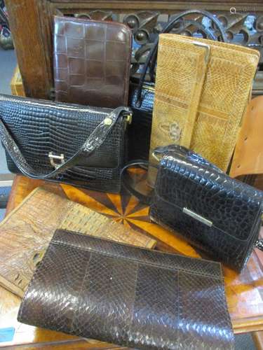 A vintage reptile stationary folder, a snakeskin clutch bag and two others, together with