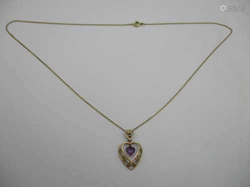 A 14ct gold fine necklace 1.5g, with a 9ct gold heart shaped filigree pendant, set with amethyst,