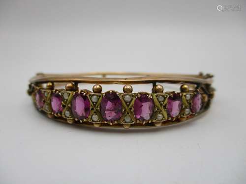 An Edwardian 9ct gold bracelet, Chester 1908 with a double wire frame set with seven amethysts and