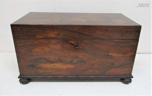 A Victorian rosewood tea caddy of rectangular form with cast bronze ring handles either side,