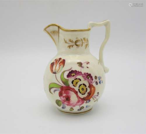 An early 19th century Staffordshire miniature jug, with hand painted floral sprays ad gilt