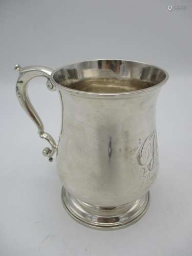A George II silver tankard by Robert Collier, London 1748, with bell shaped body, scrolled handle