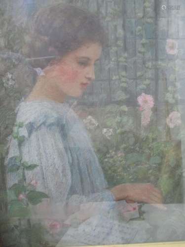 British School, early 20th century - a half length portrait of a girl picking flowers in front of