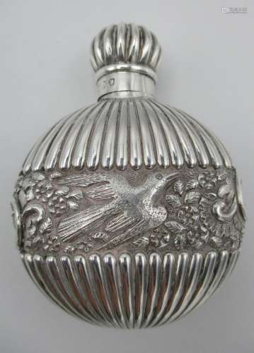 A Victorian silver snuff bottle by Samson Mordan, London 1888, of circular form with fluted design