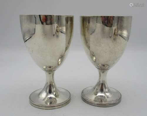 A pair of George III silver goblets by Henry Chawner, London 1789, with plain bodies on short