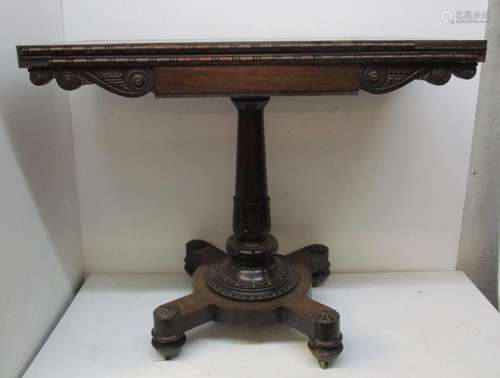 A William IV period rosewood card table, with moulded frieze and apron, the top with chamfered